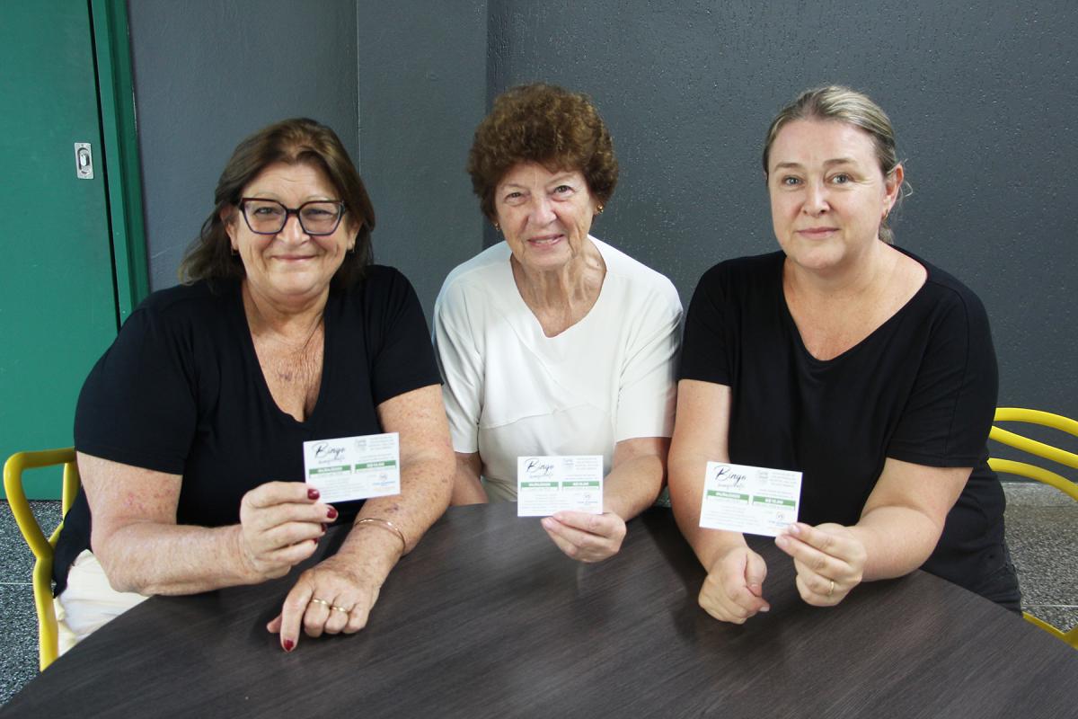 Voluntárias Neusa, Eliana e Angela convidam a comunidade para mais um evento beneficente